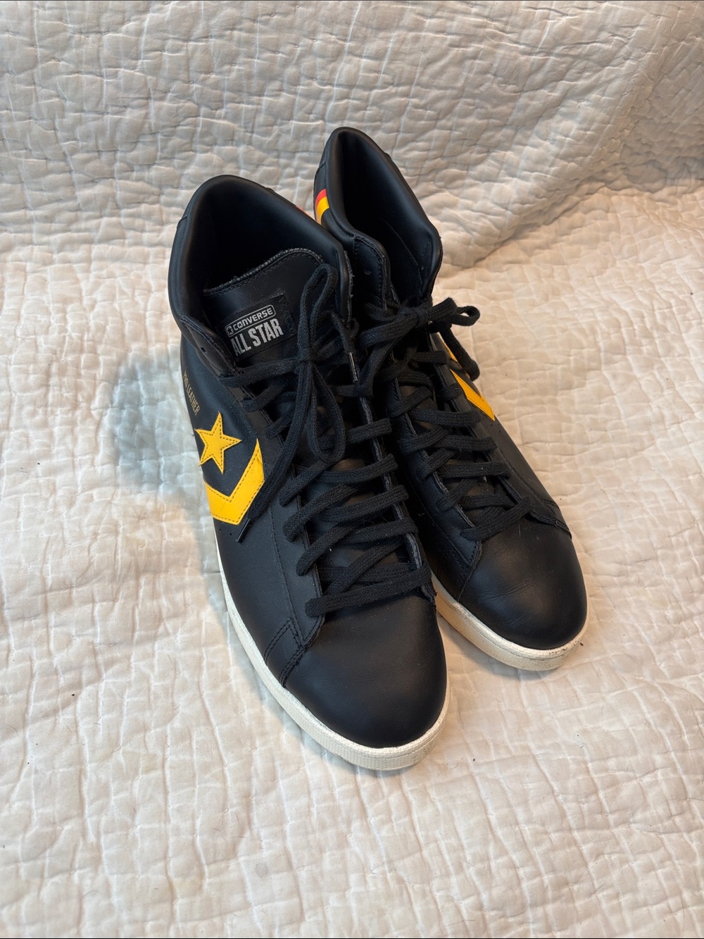 Converse Black High-Top Sneakers with Yellow Star Accent